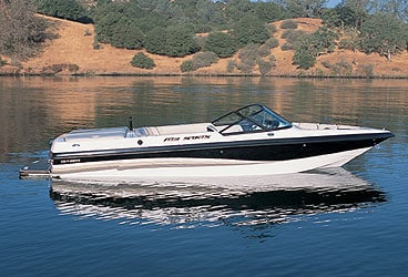 Traditional runabout boat on water